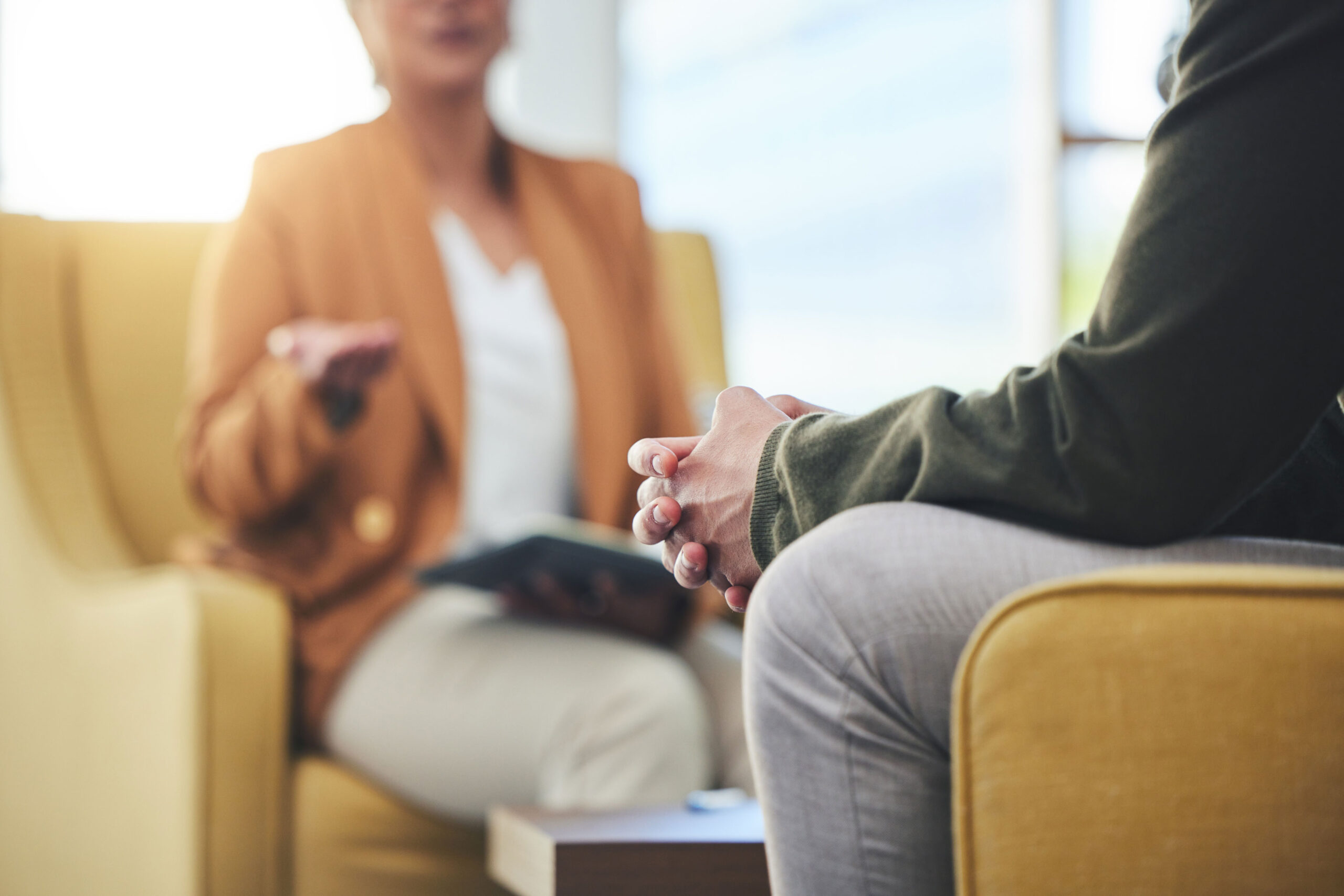 Therapist speaking with a client